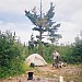 After a week of canoeing in the boundary waters we take an afternoon on Fishers Island to kick back and relax before completing our trip of over 75 miles. Boots drying in foreground. Alps Mountaineering "Taurus 4" and me in homemade moccasins in background. Boundary Waters, MN