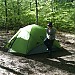 Little man outside the tent.