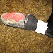 Dog bootie taping technique