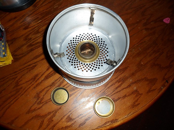 I use this wick alcohol stove. It is super light and allows me to