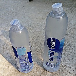 Disposeable plastic water cups on table for drinking at a road