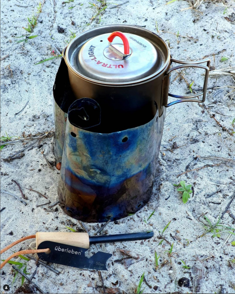 I use this wick alcohol stove. It is super light and allows me to