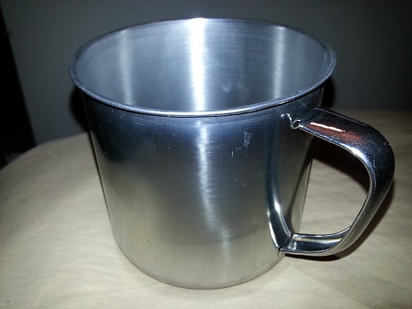 Just bought a old stainless steal Coleman mug from goodwill for 3 bucks and  just used a little brasso on it : r/CampingGear